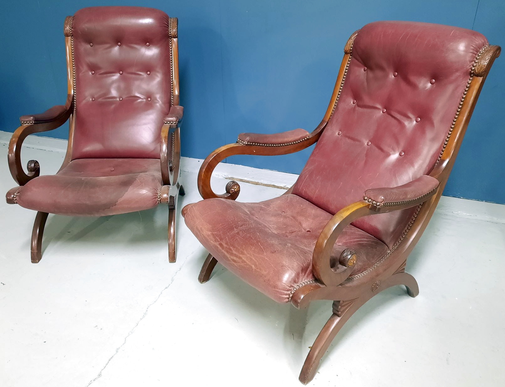 A pair of French Empire "Lazy" Armchairs